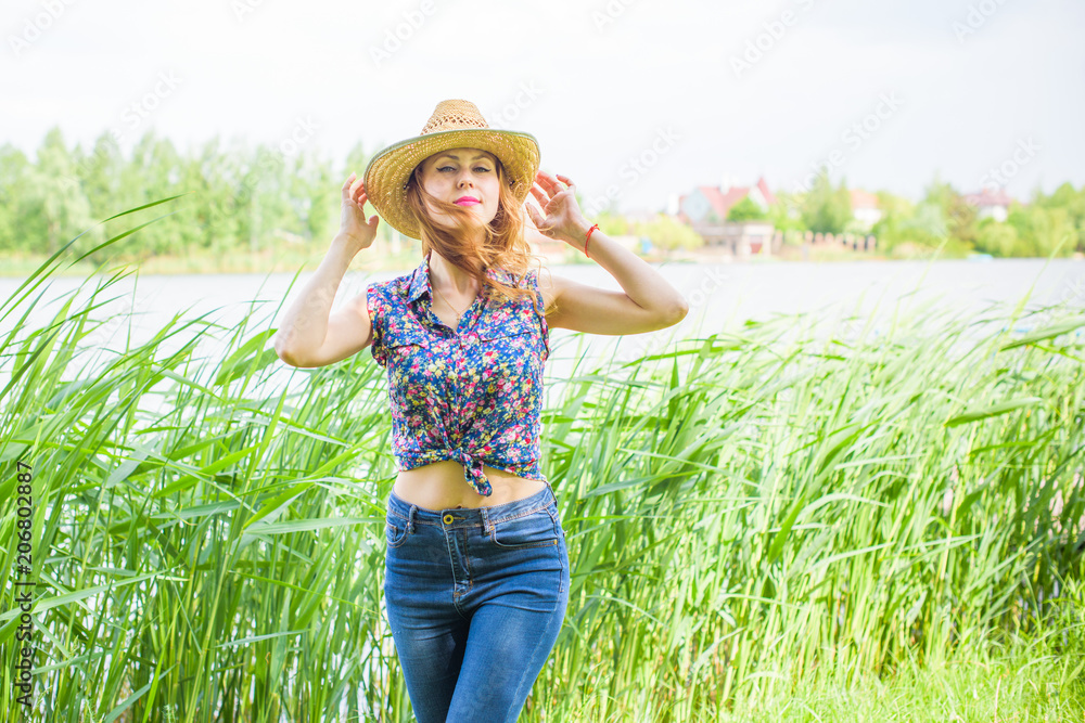 Woman rest on a nature. Concept of vacation or weekend. Young stylish lady relax outdoor. Good  and romantic mood. Love the life and joy.  Pieces of life 