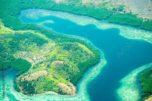 Aerial view of Busuanga island. Tropical lagoon with turquoise water, coral reef and white sand.