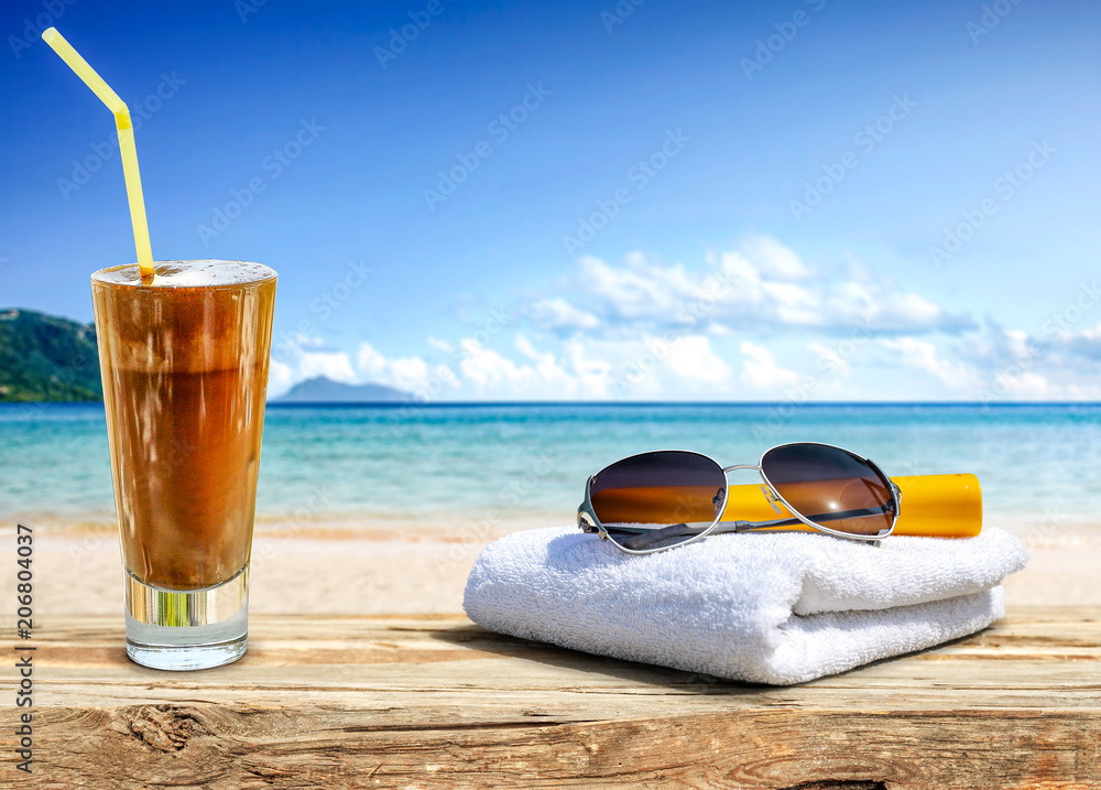 summer drink on desk and beach landscape 