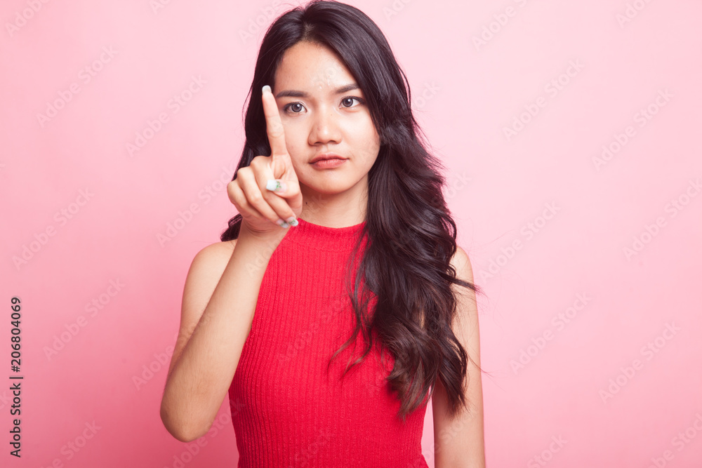 Asian woman touching the screen with finger. Asian woman touching the screen with finger.