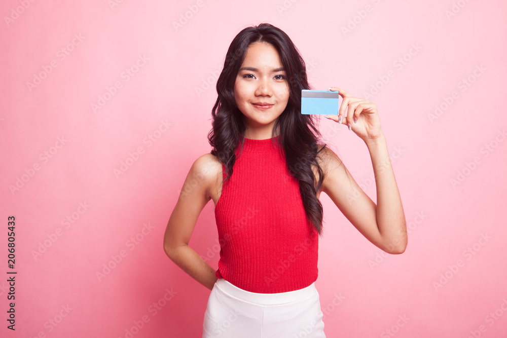 Young Asian woman with a blank card. Young Asian woman with a blank card.
