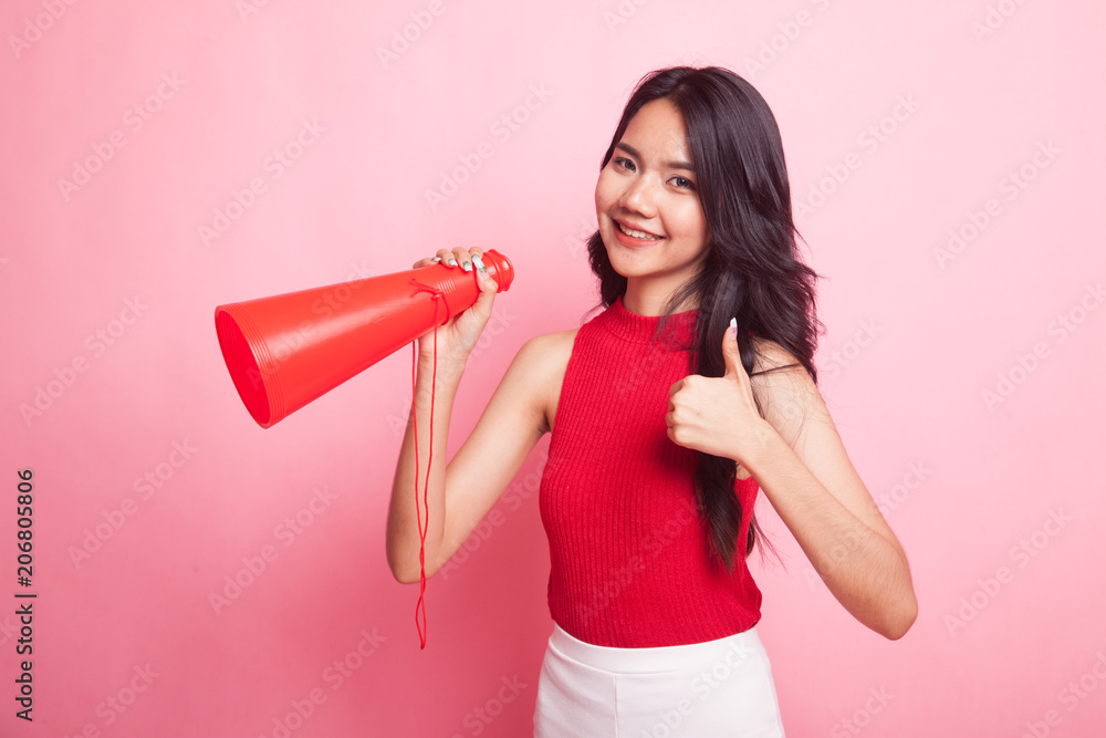 Beautiful young Asian woman show thumbs up announce with megaphone. Beautiful young Asian woman show thumbs up announce with megaphone.
