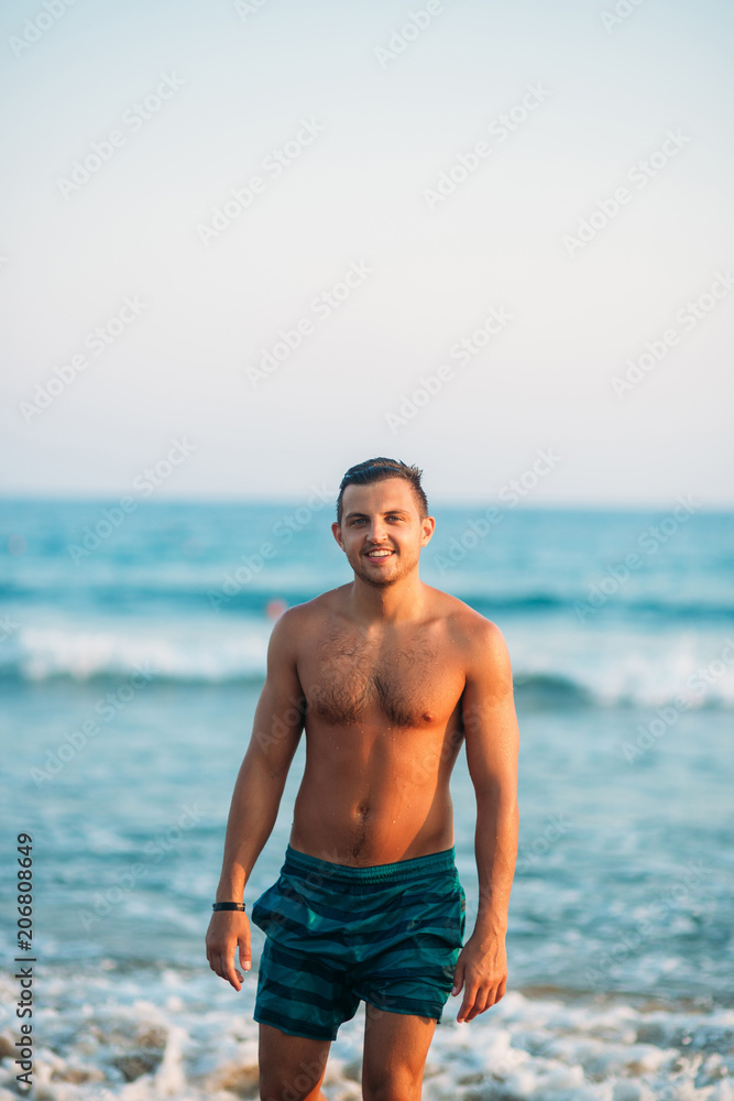 Portrait of an attractive young man on a tropical beach Portrait of an attractive young man on a tropical beach