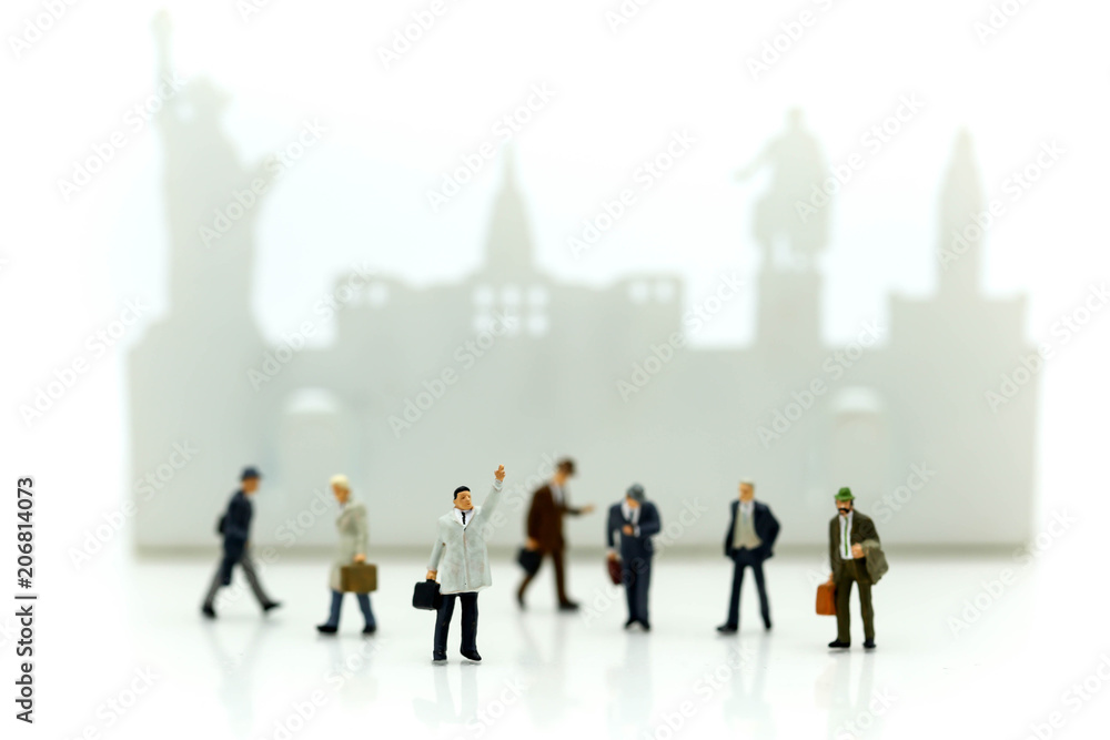 Obraz premium Miniature people : businessman waiting for a taxi in front of the airport,business meeting concept.