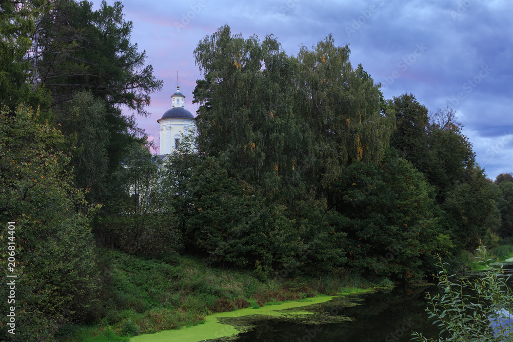 The Church on the river Bank surrounded by trees The Church on the river Bank surrounded by trees