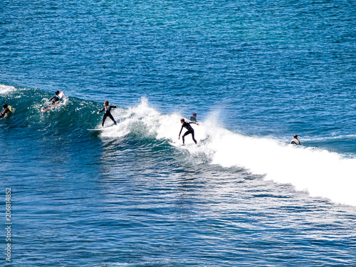 Surfer riding the waves in Bells Beach