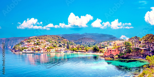 Beautiful landscape with bay and colorful buildings on the background of picturesque clouds in the town of Asos, Greece, Kefalonia. Wonderful exciting places. Panorama. photo