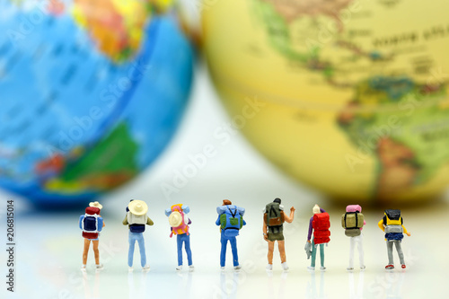 Miniature people : Travelers with world globe and airplane , traveling or exploring the world, budget travel concepts.