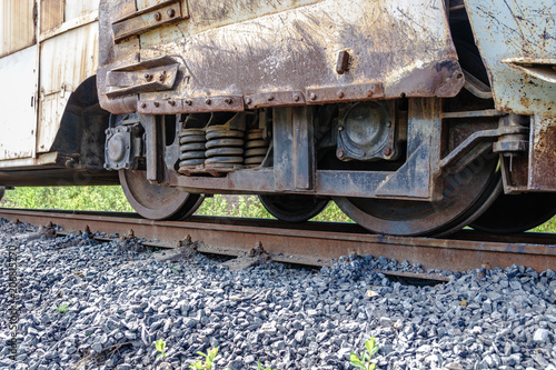 A closeup view of the wheels of a train