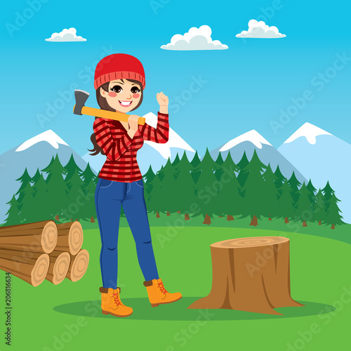 Beautiful brunette female lumberjack cutting tree with axe on forest background
