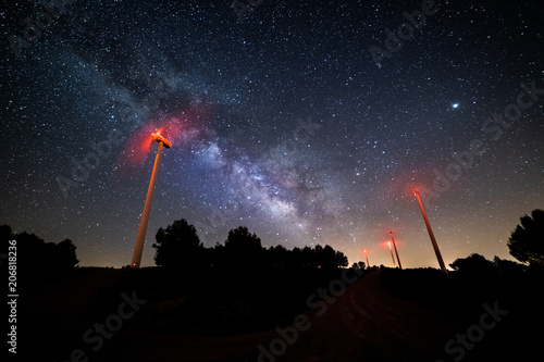 Fototapeta Naklejka Na Ścianę i Meble -  Wind power mill with the Milky Way behind it