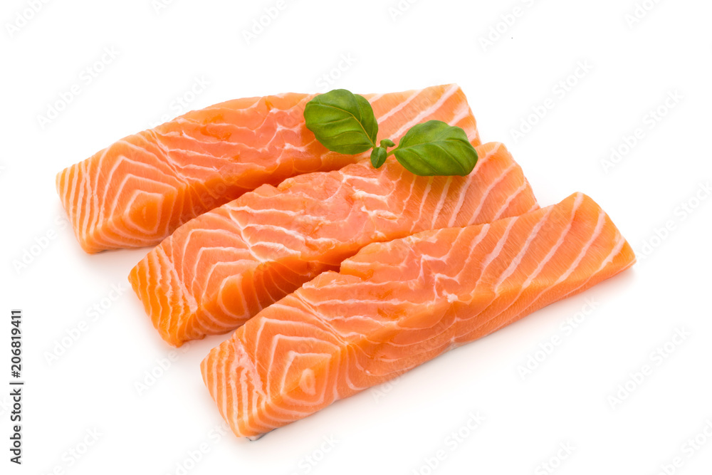 Fresh salmon fillet with basil on the white background.