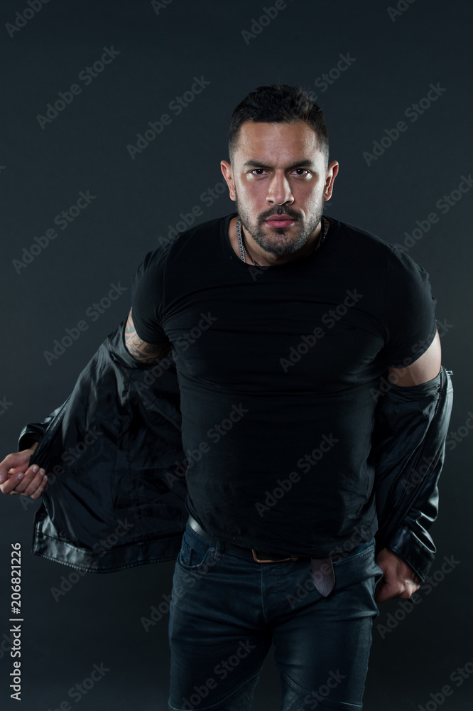 Man in tshirt undress leather jacket. Bearded man with serious face. Fashion macho in casual style clothes. Confidence and charisma. Fashion style and trend concept