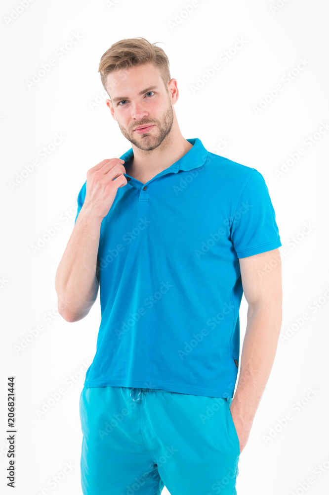 Bearded man in blue casual clothes isolated on white. Man in tshirt and shorts isolated on white. Macho in active wear for workout or training. Sport fashion style and trend. Fitness and gym activity Bearded man in blue casual clothes isolated on white. Man in tshirt and shorts isolated on white. Macho in active wear for workout or training. Sport fashion style and trend. Fitness and gym activity