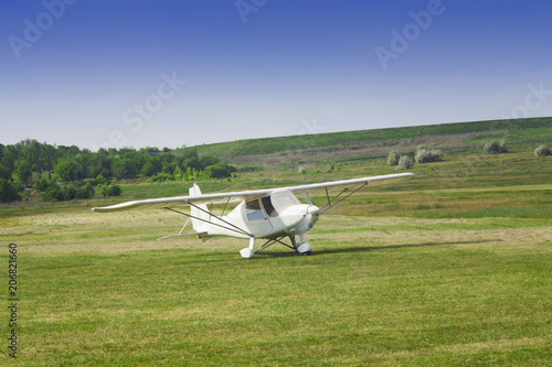 small airplane ready to take off on the airfield