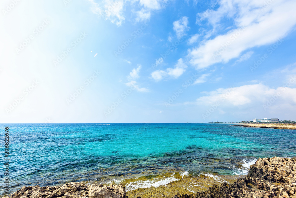 Daylight view to Nissi Beach with colorful bright blue water and sky