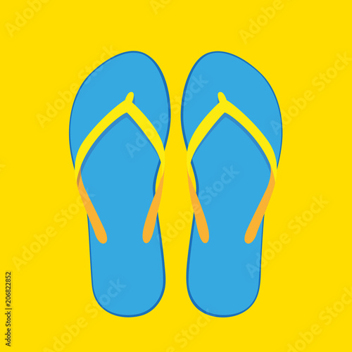 ein paar blau gelbe flipflops auf gelben hintergrund