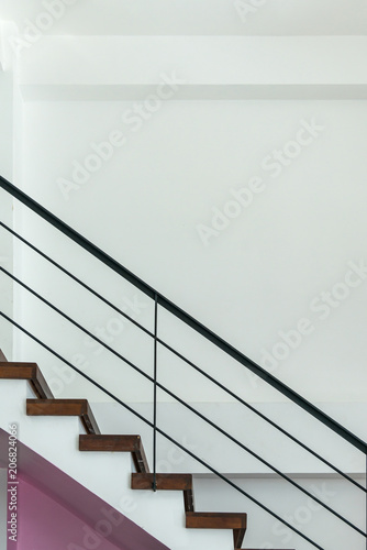 Stairway with metallic banister in a new modern building.