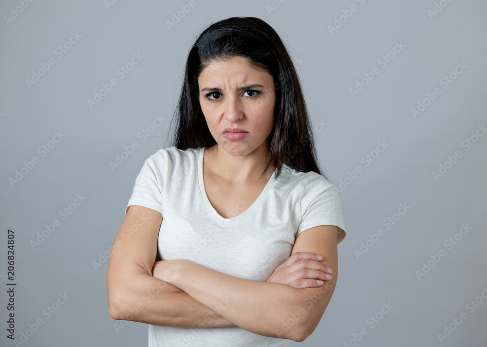 Human expressions and emotions. Young attractive woman with an angry face, looking furious and upset Human expressions and emotions. Young attractive woman with an angry face, looking furious and upset