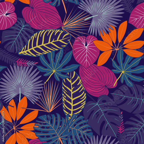 Seamless pattern from tropical leaves. multi-colored tropical leaves pattern