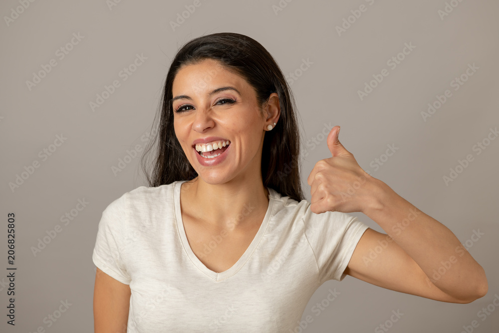 Young attractive woman with a happy face, smiling. Human expressions and emotions.