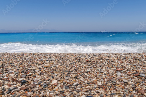 Summer day and turquoise harmony sea gentle waves at the coast