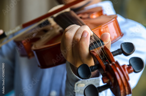 A young artist playing violin and