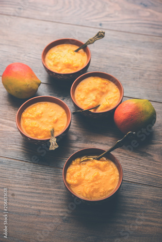 Mango Pulp / Aam rus or Ras served in small bowls, selective focus photo