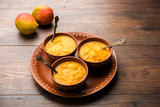 Mango Pulp / Aam rus or Ras served in small bowls, selective focus