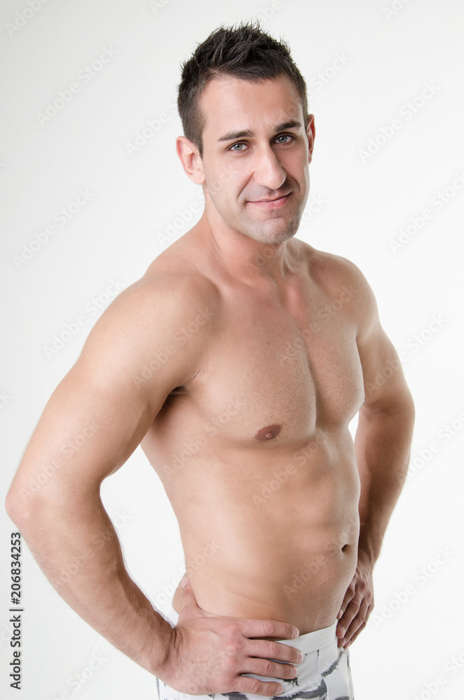 Fototapeta premium Sexy athletic man. Gray background. 