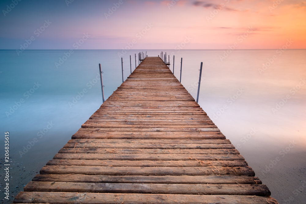 sunset pier in the sea of minimalism