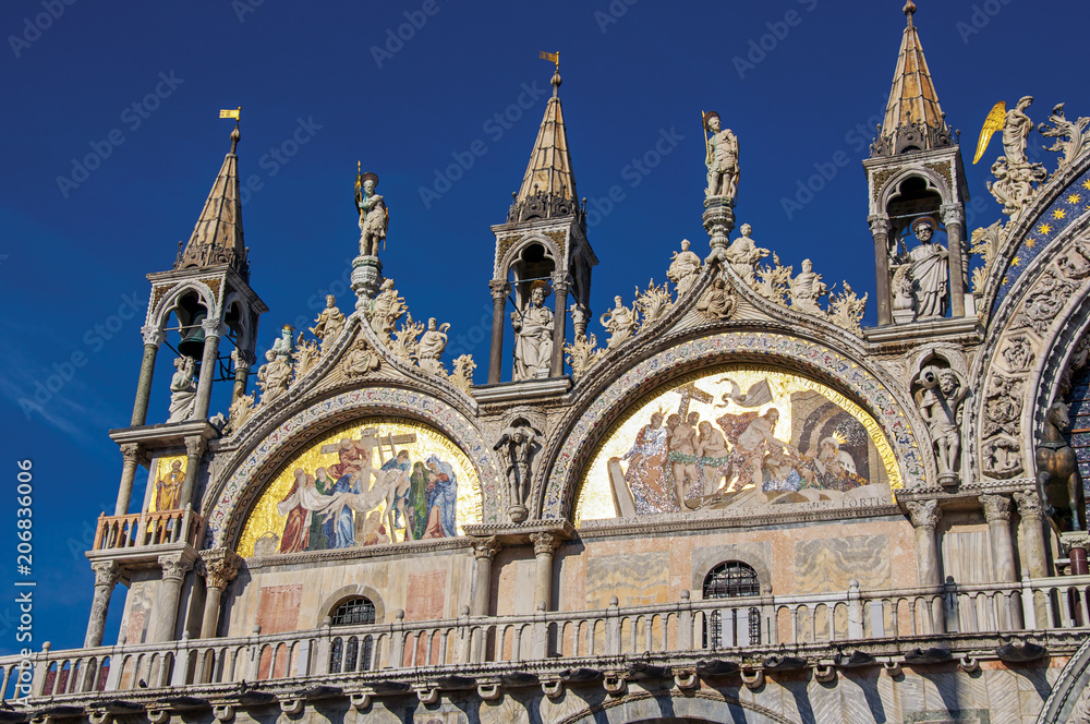 Naklejka premium Close-up of sculptures and frontispiece made in marble and gold on the San Marco Basilica. At the city of Venice, the historic and amazing marine city. Located in Veneto region, northern Italy
