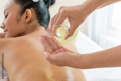 woman lying down on a massage bed at a spa