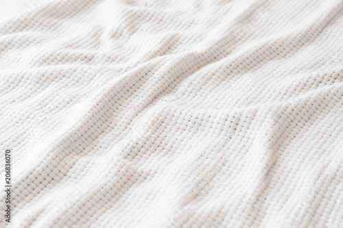 abstract white crumpled fabric background. wrinkled canvas fiber cloth. fabric texture backdrop design. copyspace concept