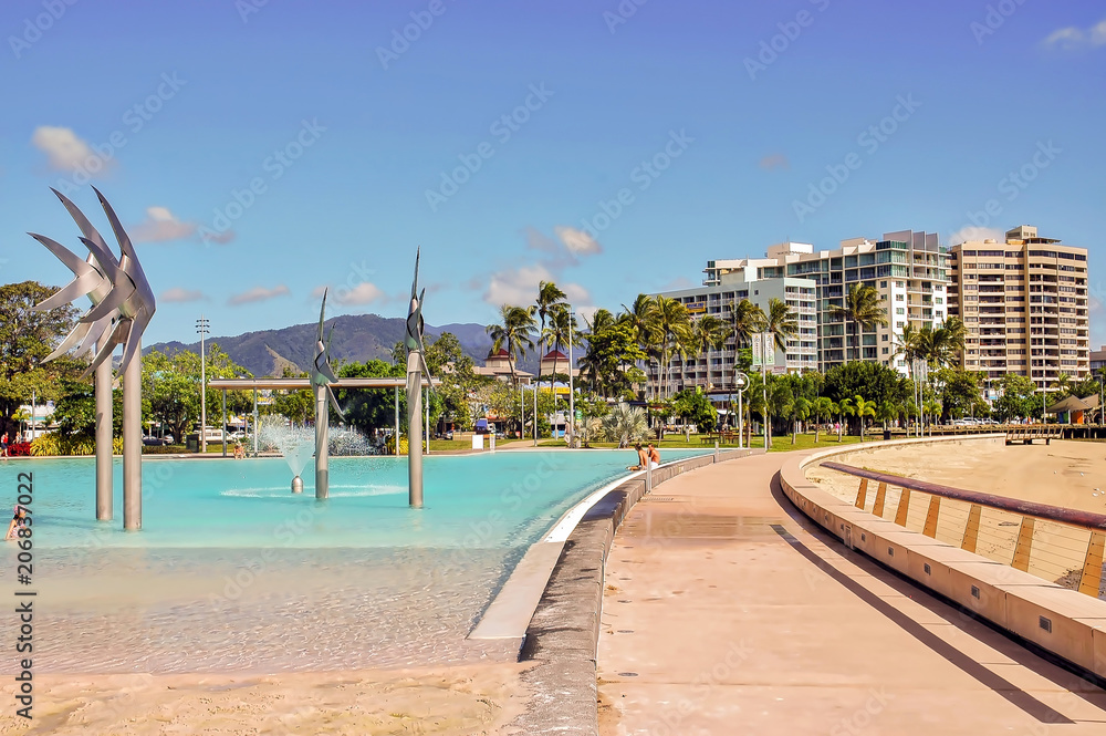 View of public pool and coastal buildings in Cairns, Australia.