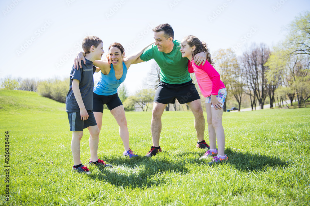 Parents with children sport running together outside Parents with children sport running together outside