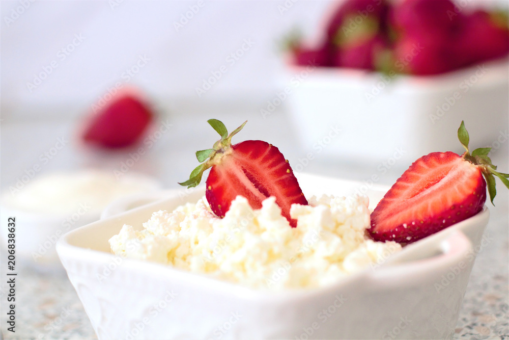 Tasty food. A dish of fresh strawberries and cottage cheese. Vitamin supplement. Dietary and vegetarian product. Add healthy and nutritious food to your diet. Tasty food. A dish of fresh strawberries and cottage cheese. Vitamin supplement. Dietary and vegetarian product. Add healthy and nutritious food to your diet.