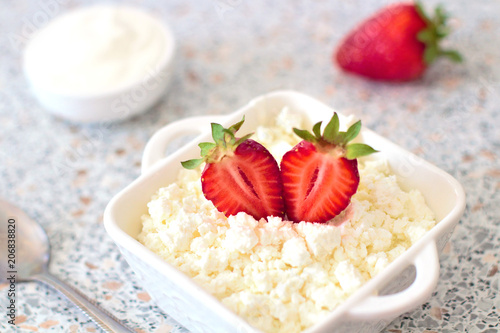 Tasty food. A dish of fresh strawberries and cottage cheese. Vitamin supplement. Dietary and vegetarian product. Add healthy and nutritious food to your diet.