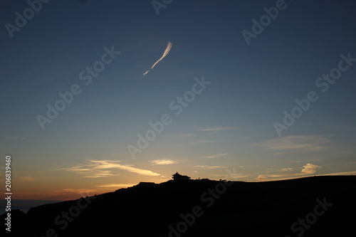 Silhouetted Hilltop Pagoda at Sunset