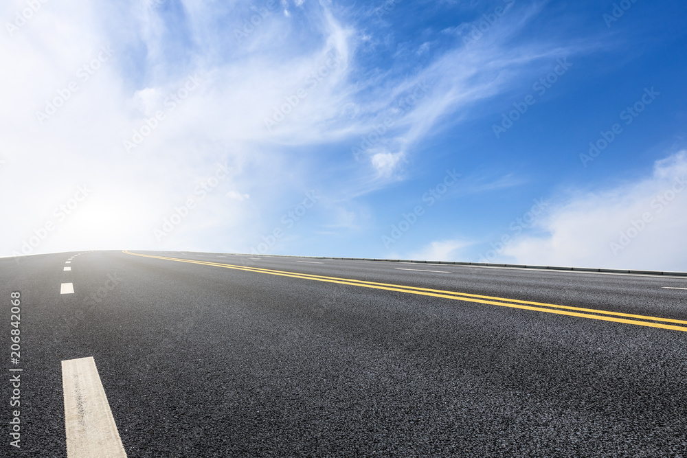 Naklejka premium new asphalt road and sky clouds