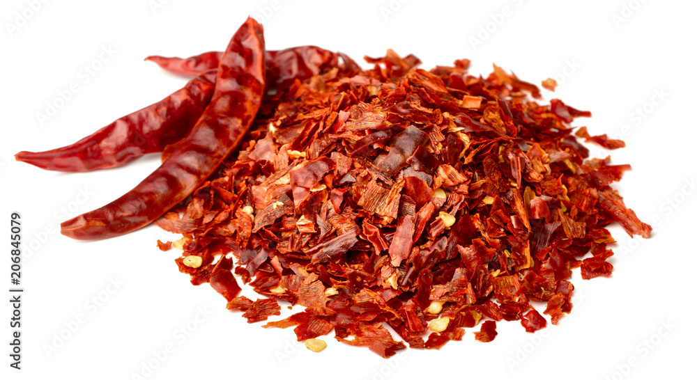 Fototapeta premium dried red pepper flakes isolated on white