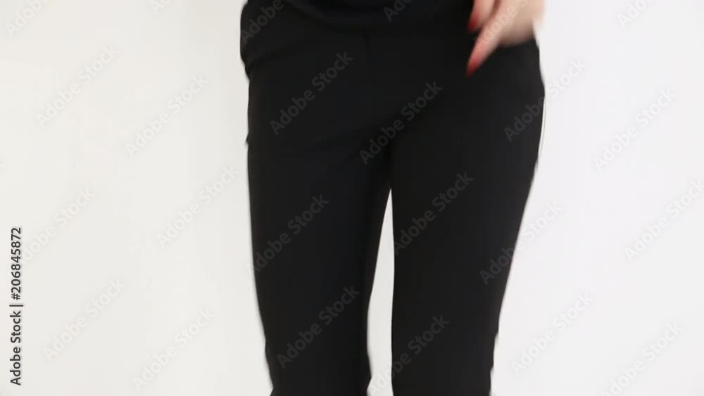 a teenage girl in black hip-hop clothes and a cap dances at the white wall- close-up, handheld shoot, small depth of field a teenage girl in black hip-hop clothes and a cap dances at the white wall- close-up, handheld shoot, small depth of field