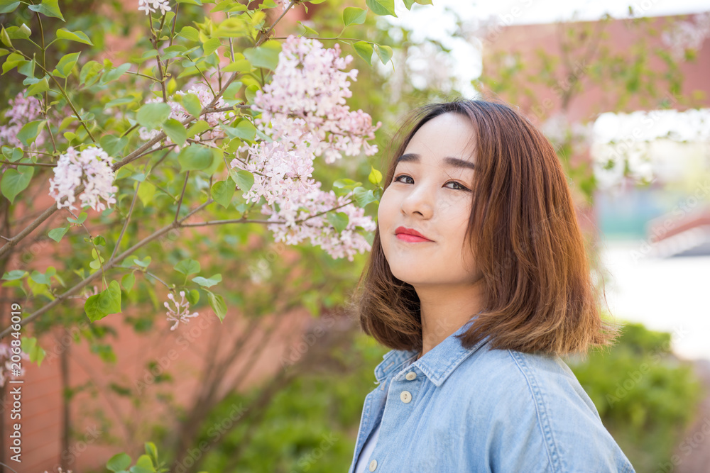 Beautiful girl with lilac flowers Beautiful girl with lilac flowers