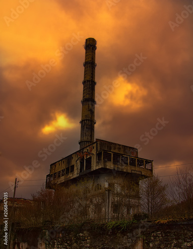 Abandoned factory in mountains. photo