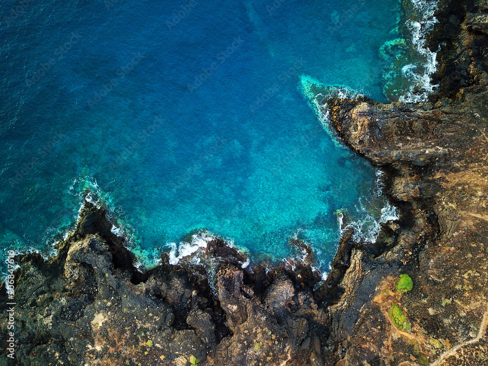 skraber Bliver værre dyr Top view of a deserted coast. Rocky shore of the island of Tenerife. Aerial  drone footage of sea waves reaching shore Stock Photo | Adobe Stock