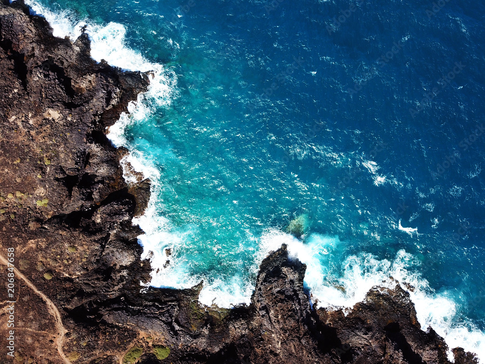 skraber Bliver værre dyr Top view of a deserted coast. Rocky shore of the island of Tenerife. Aerial  drone footage of sea waves reaching shore Stock Photo | Adobe Stock