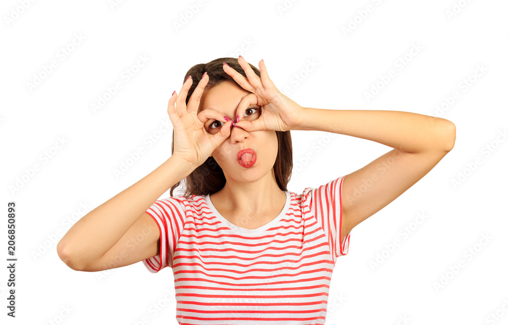 Portrait of crazy creative girl showing tongue out and binoculars on eyes with fingers. emotional girl isolated on white background Portrait of crazy creative girl showing tongue out and binoculars on eyes with fingers. emotional girl isolated on white background