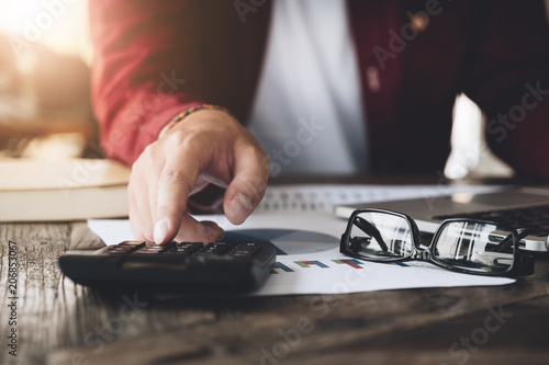 Close up view of bookkeeper or financial inspector hands making report, calculating or checking balance. Home finances, investment, economy, saving money or insurance concept