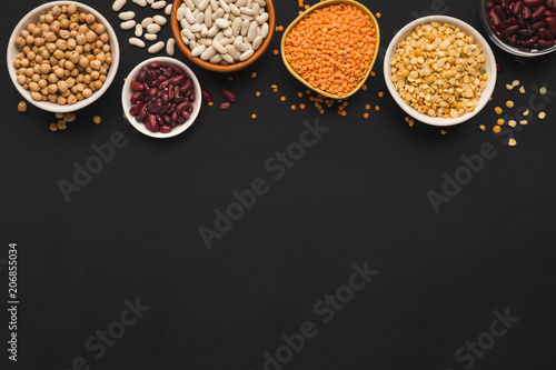 Various gluten free groats on black background with copy space