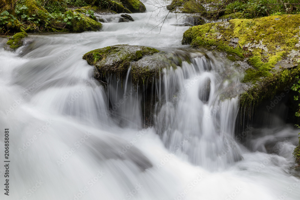 Torrent of water from the Naviego River in the Leitariegos Valley, Asturias, Spain. Torrent of water from the Naviego River in the Leitariegos Valley, Asturias, Spain.